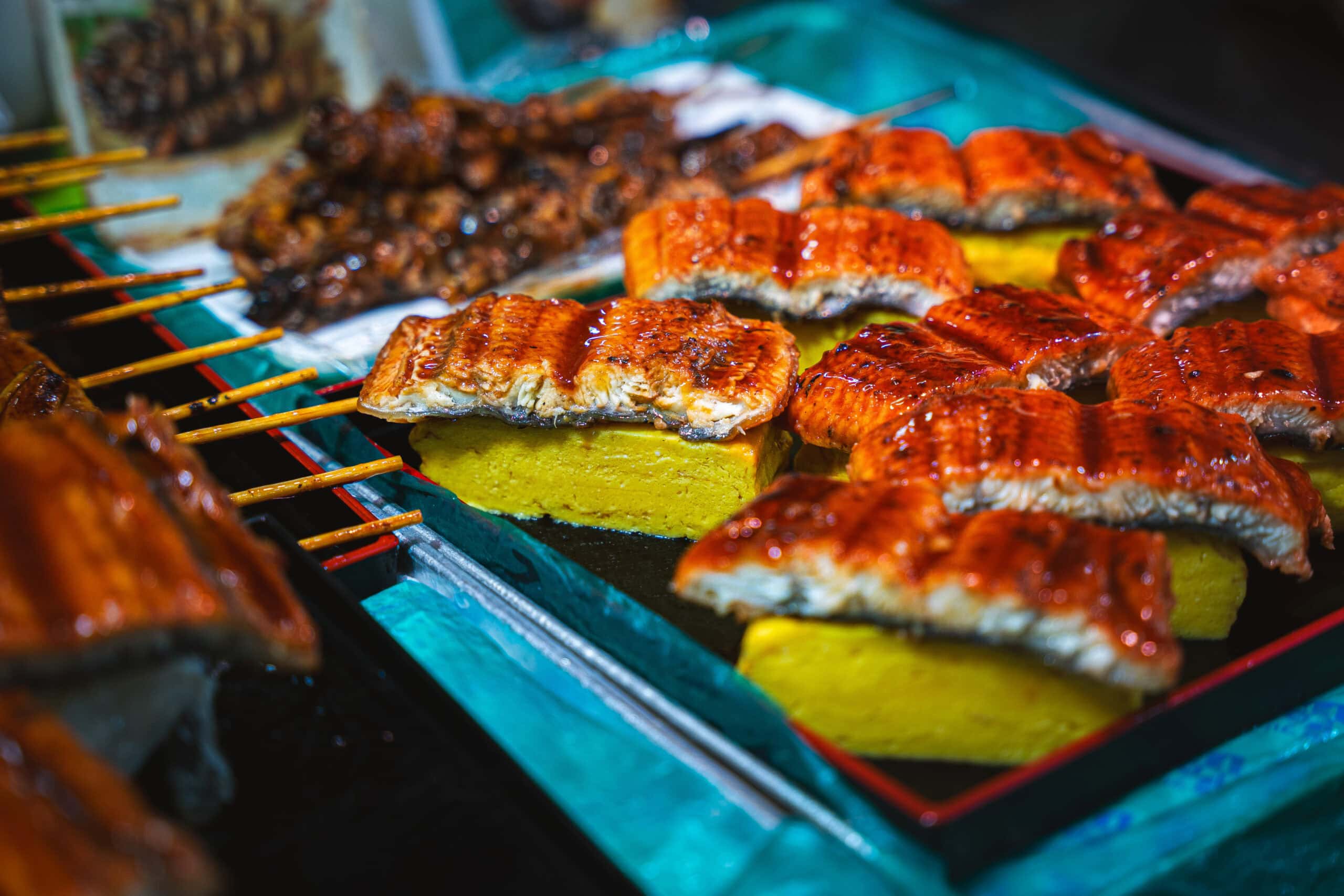 Grilled eel served on egg rolls for sale at Kurumon Market in Osaka