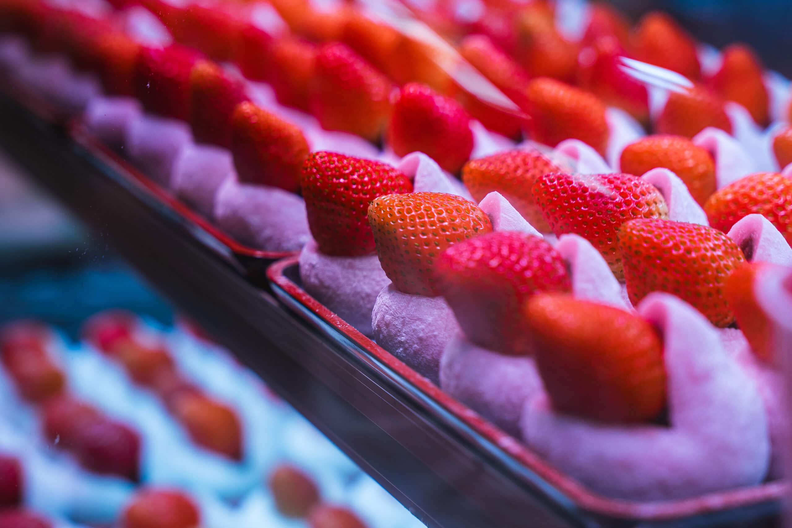 Beautiful strawberries stuffed into mochi for sale at Kurumon Market. It looks delicious