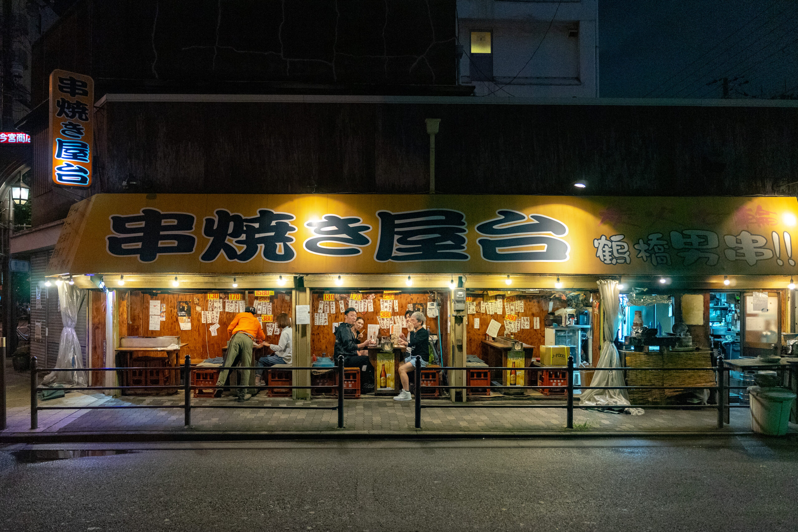 The tiny yakitori where we had dinner on our first night in Osaka. It's called Kushiyakiyatai Tsuruhashiotokogushi but the Jpanese name 串焼き屋台 鶴橋男串 is displayed on the yellow awnings