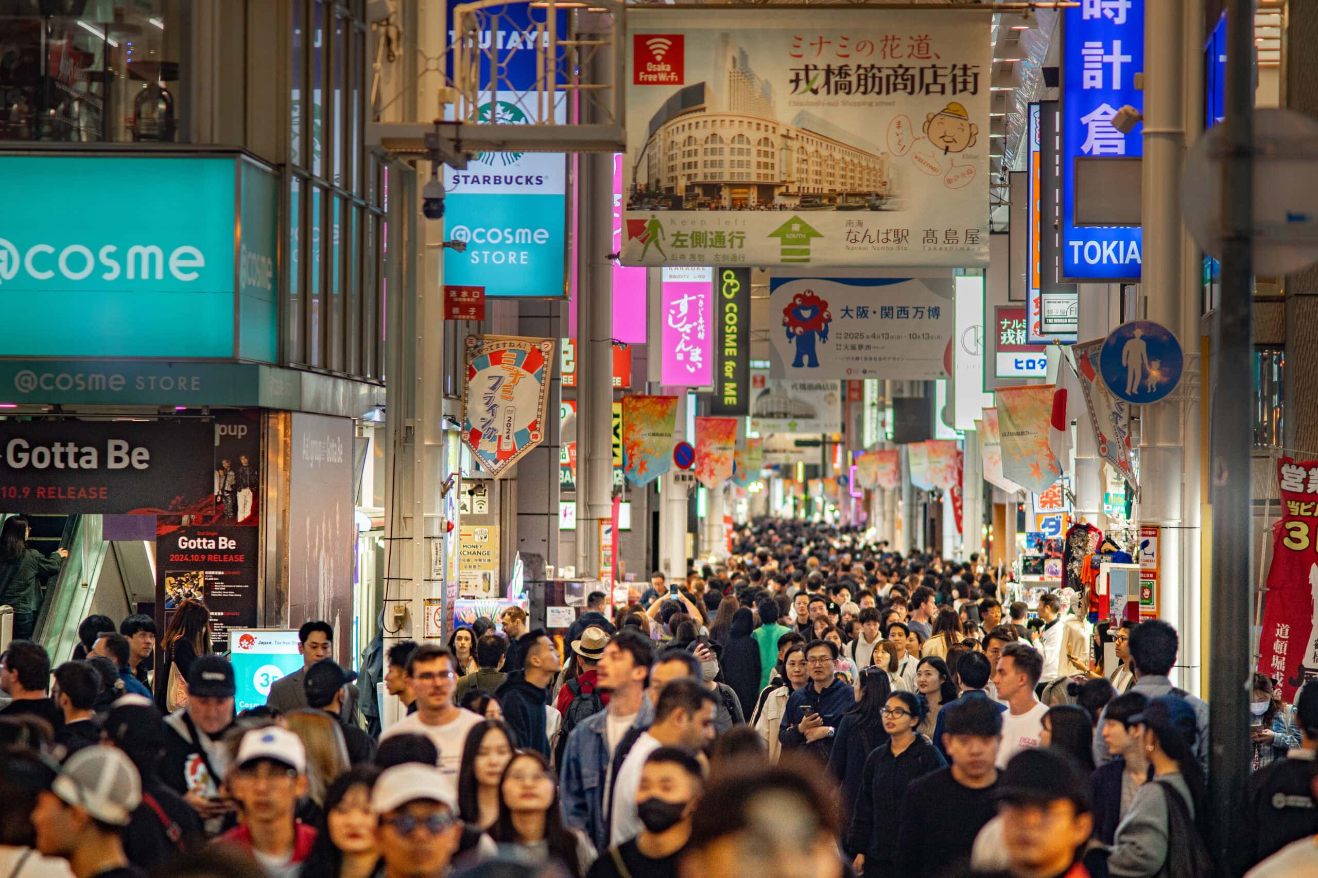 crowds walk shoulder to shoulder on Shinsaibashi-suji shopping street in Osaka