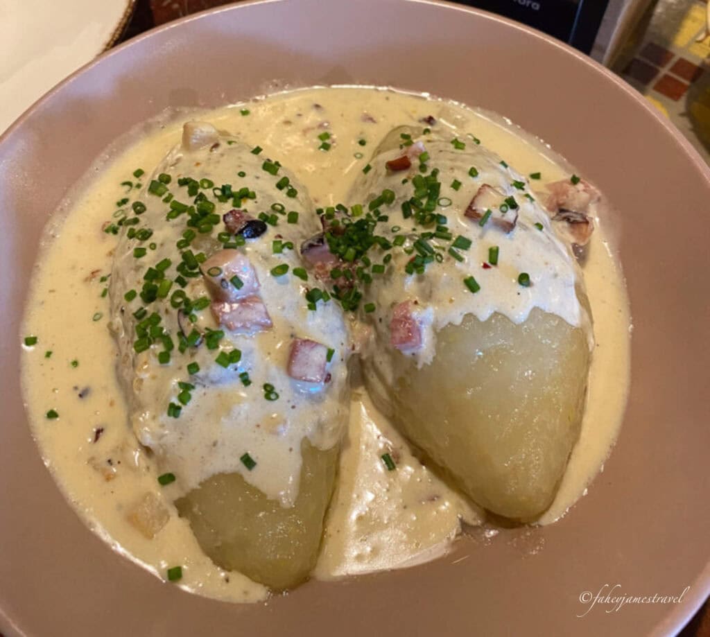 Dumplings covered in sauce, eaten at a restaurant in Riga