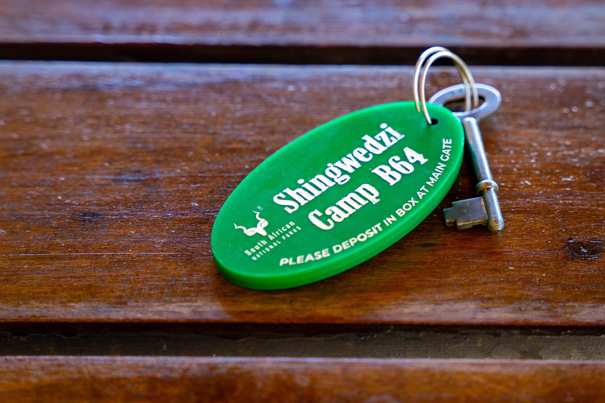 A green SANParks keyring with key to my hut