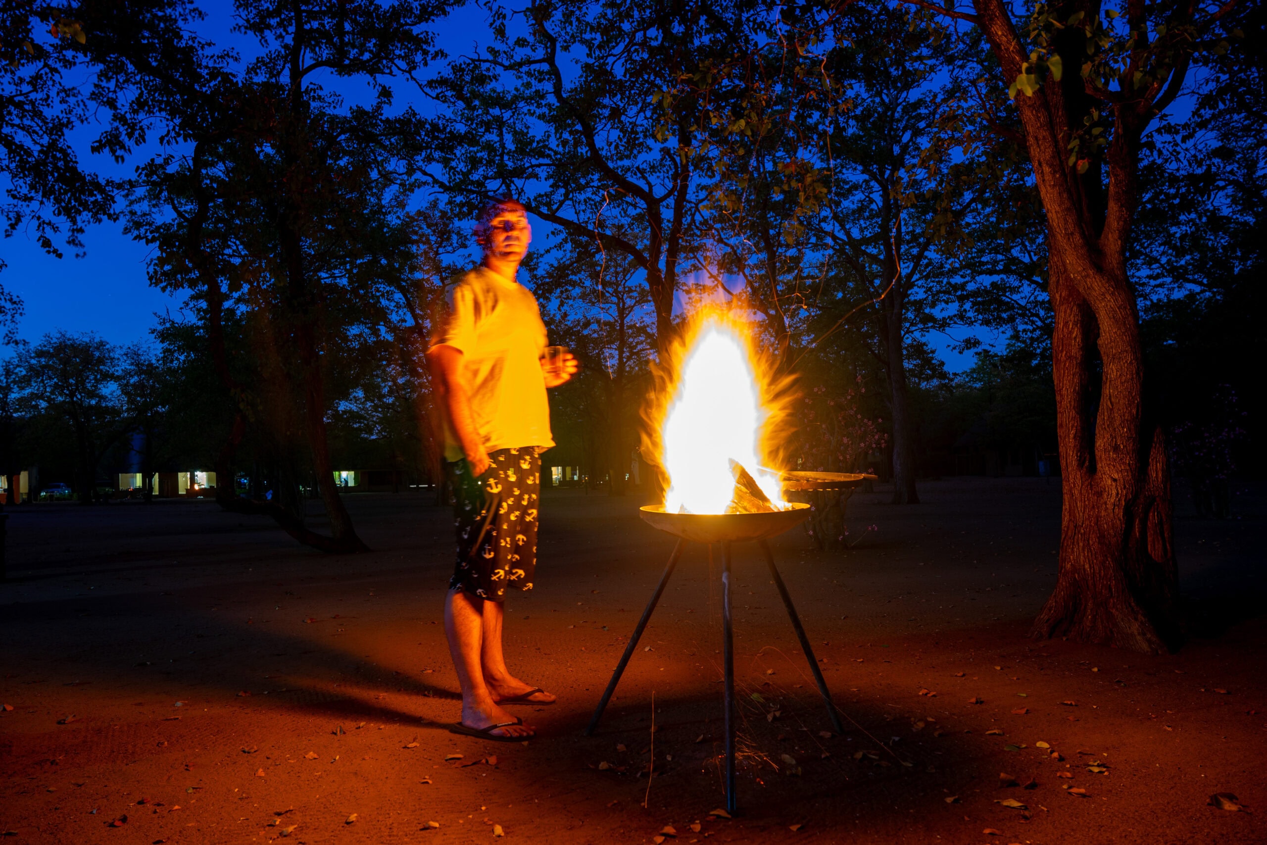 Me standing next to the braai fire at Shingwedzi Camp: cost of 4 day solo self drive safari Kruger National Park