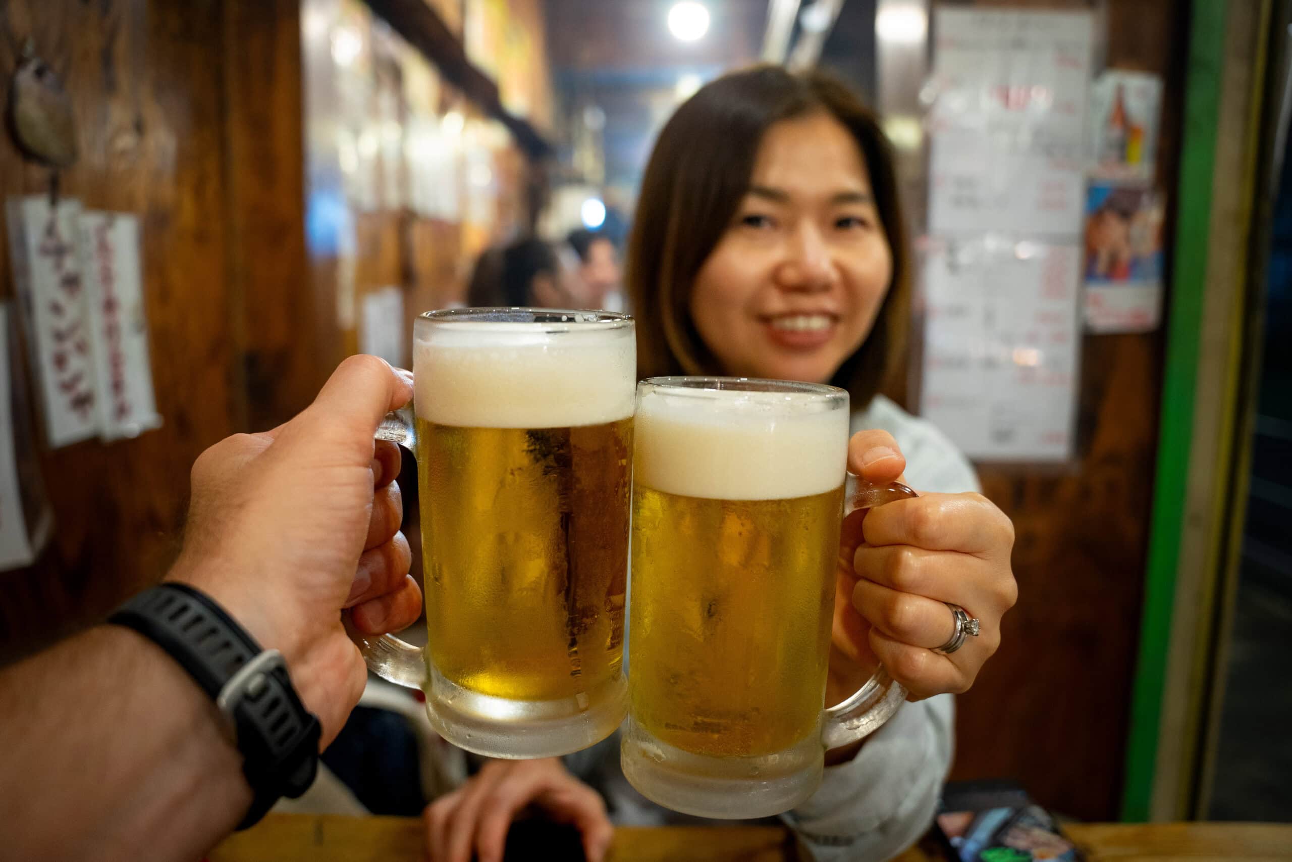 Jin and I cheers with draft beer in Osaka