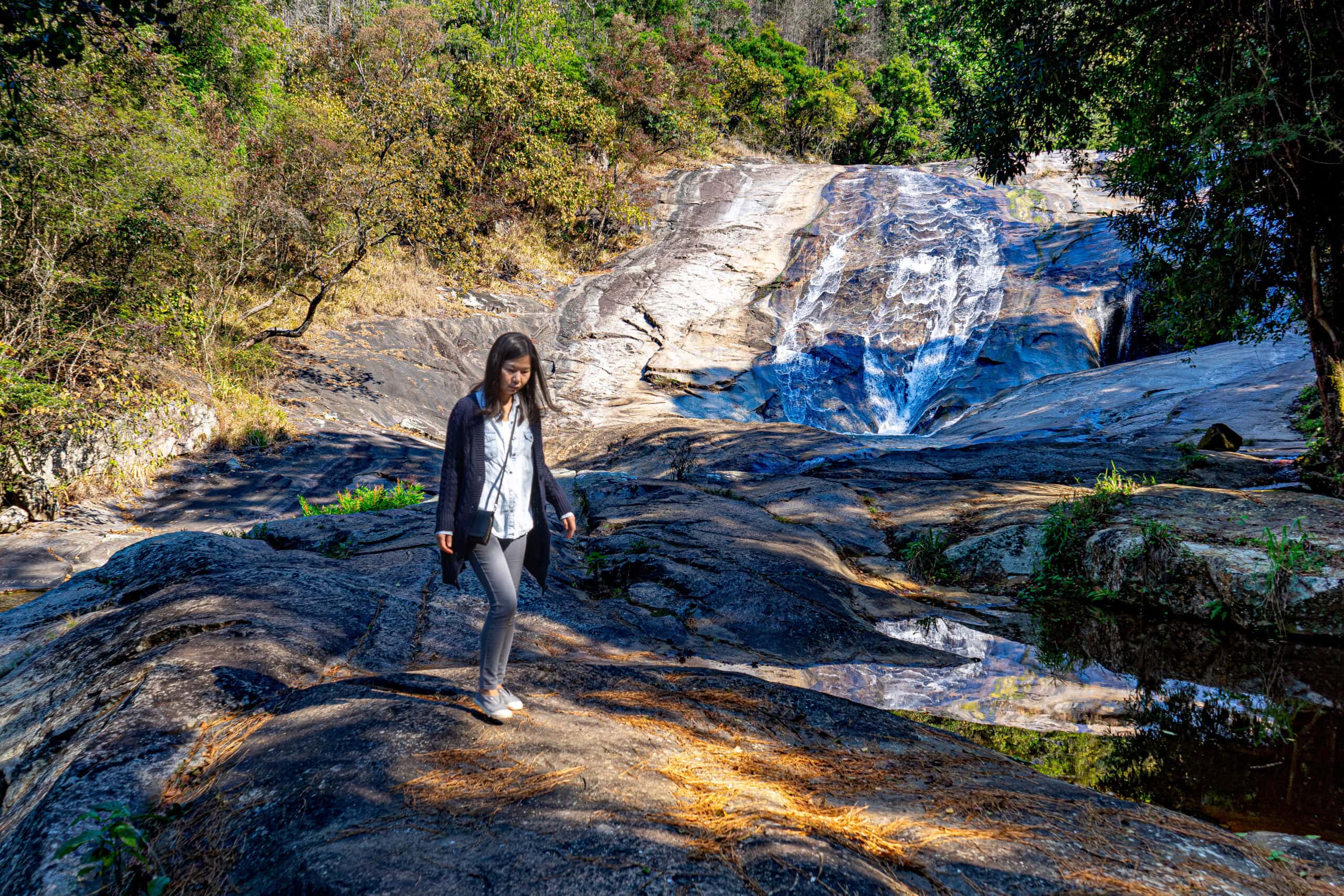 Jin walks in front of the Debengeni Falls near Magoebaskloof