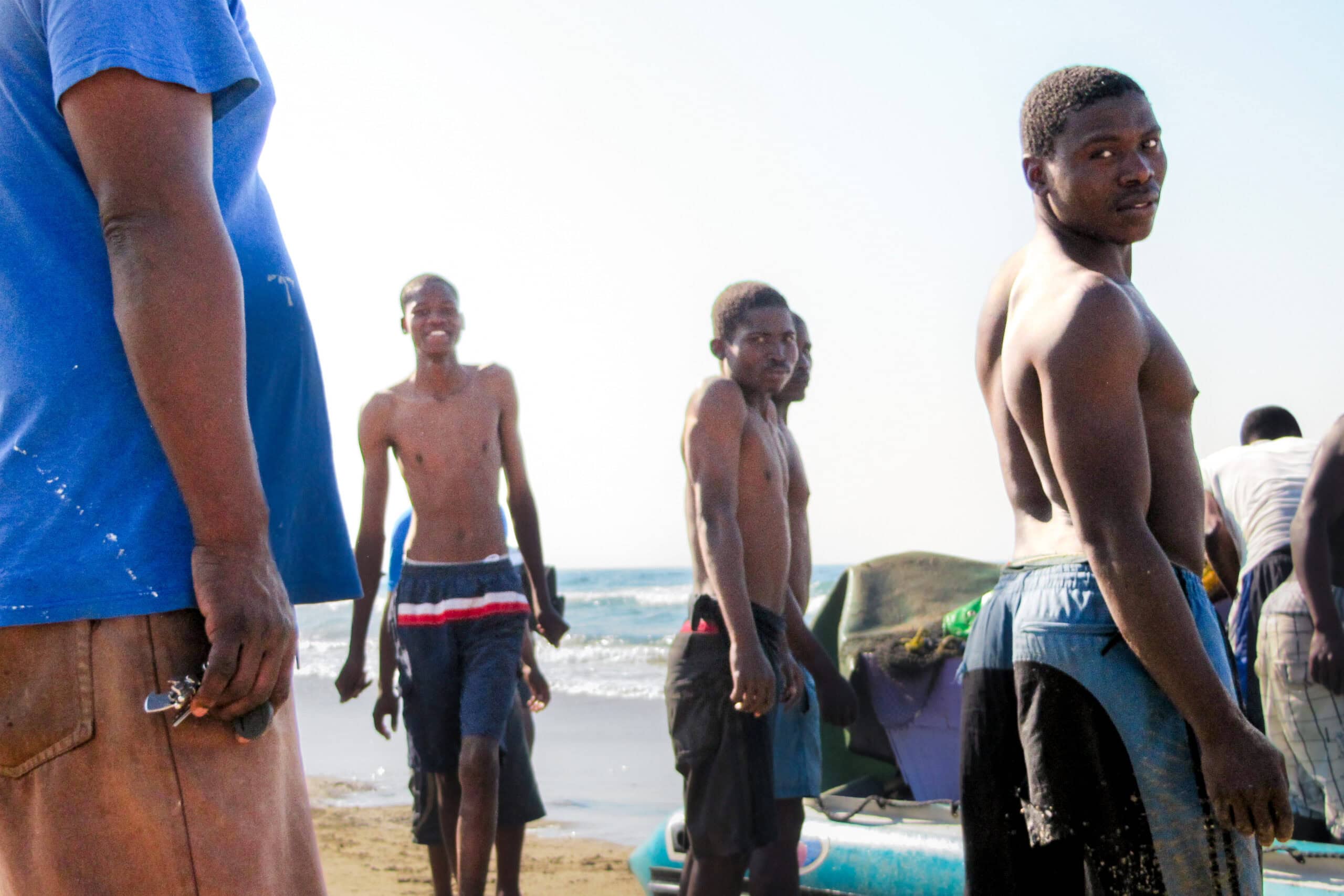 Young men on the beach in Durban, South Africa during the annual Sardine Run
