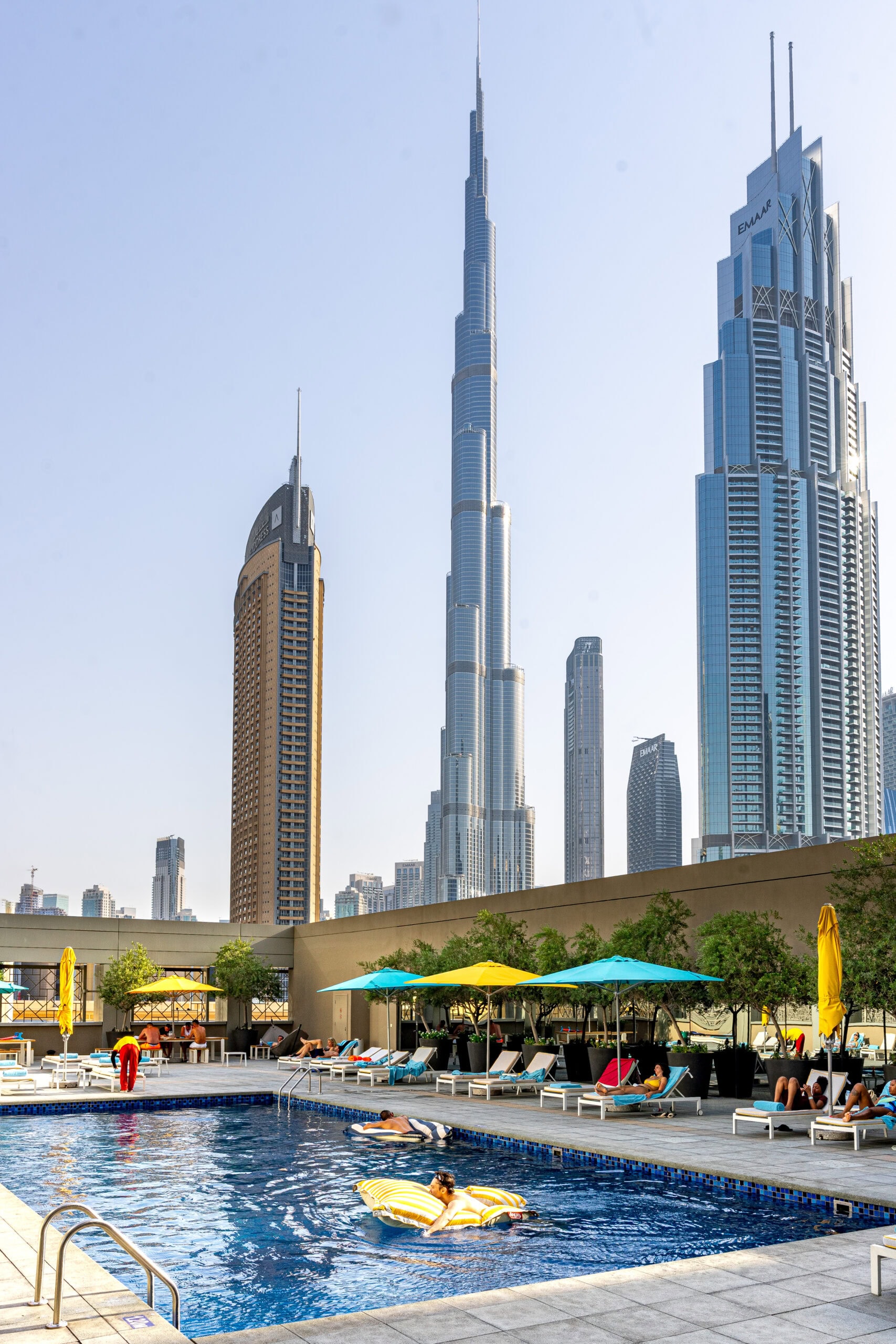 hotels in Dubai with pool under 200 dollars. Pool at Rove Downtown Dubai with Burj Khalifa towering behind it