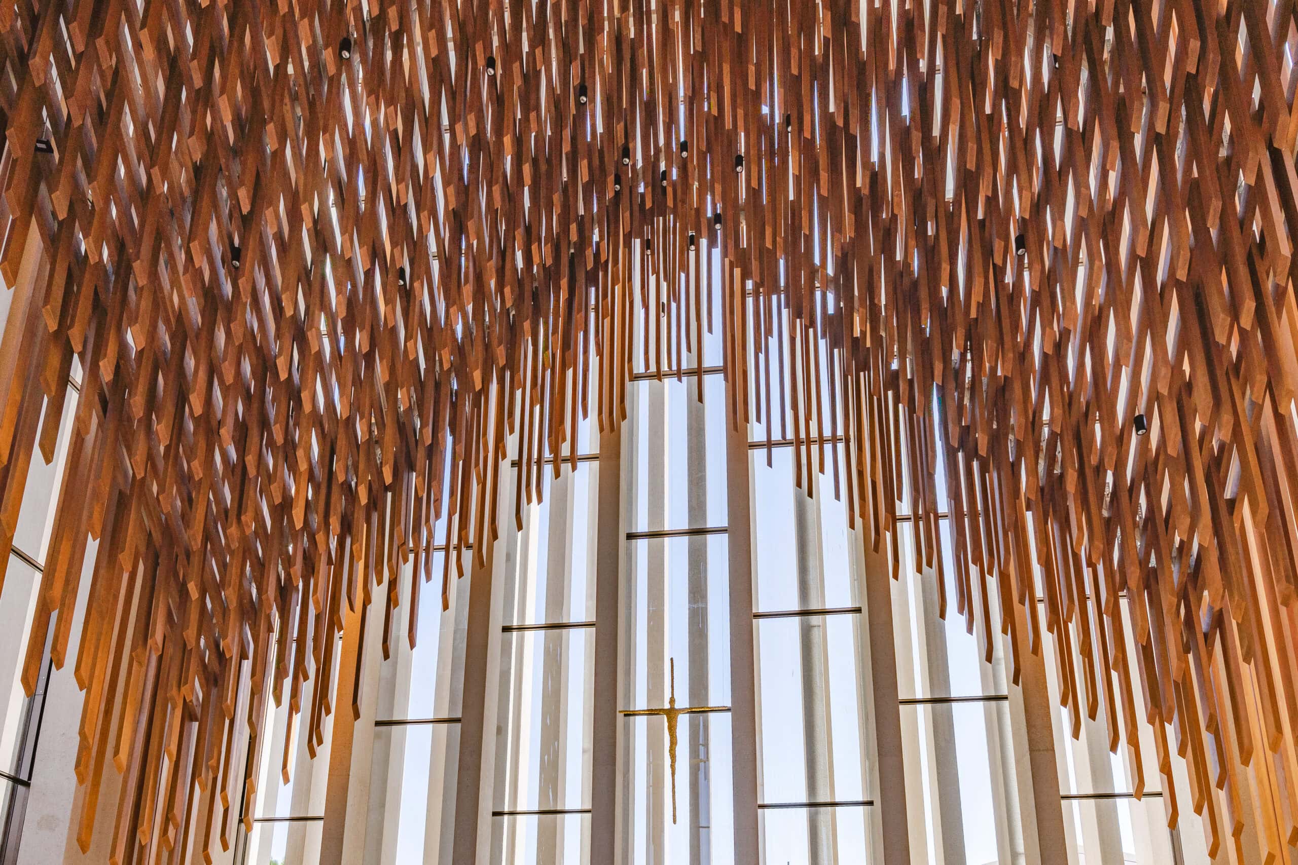 Wooden elements that look like they're raining down from the ceiling inside the church of the Abrahamic Family House