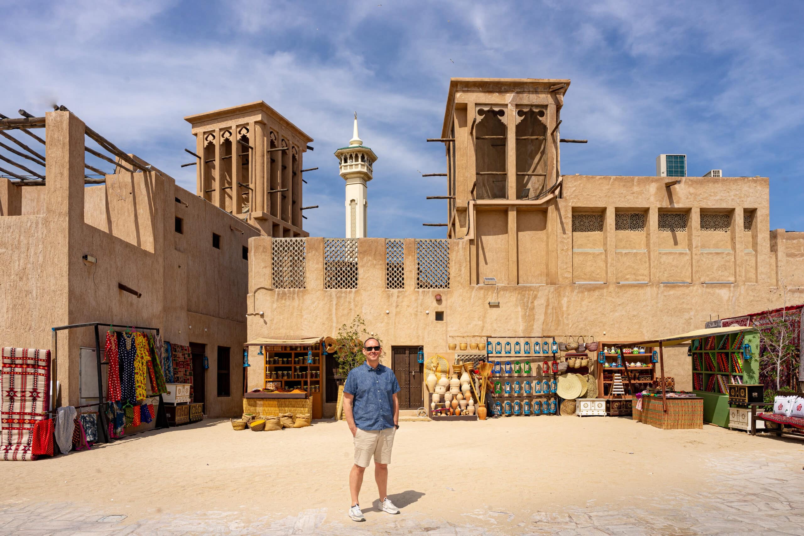 I am standing in front of traditional wind towers in Old Dubai