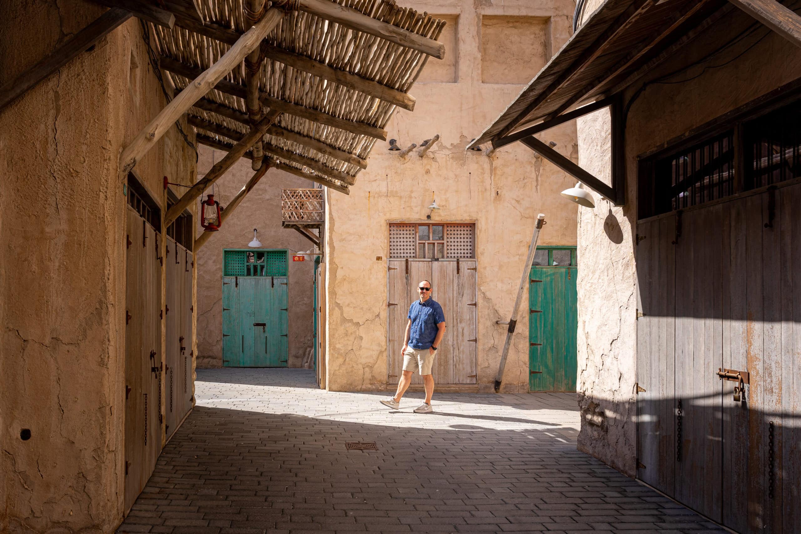 I am walking in the narrow alleys of Old Dubai, surrounded by traditional architecture