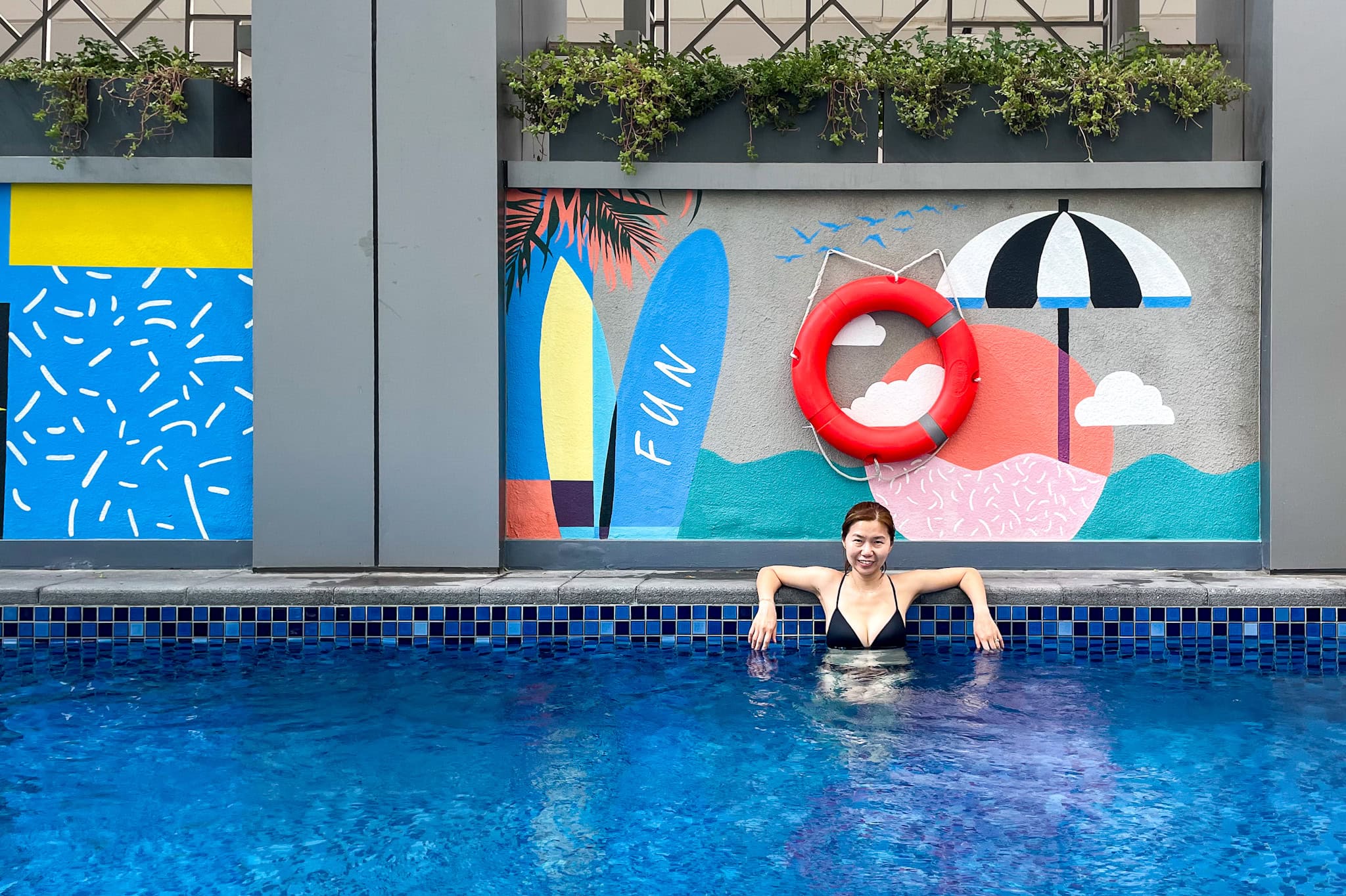 Jin in the pool at Rove Dubai Marina, Dubai layover itinerary