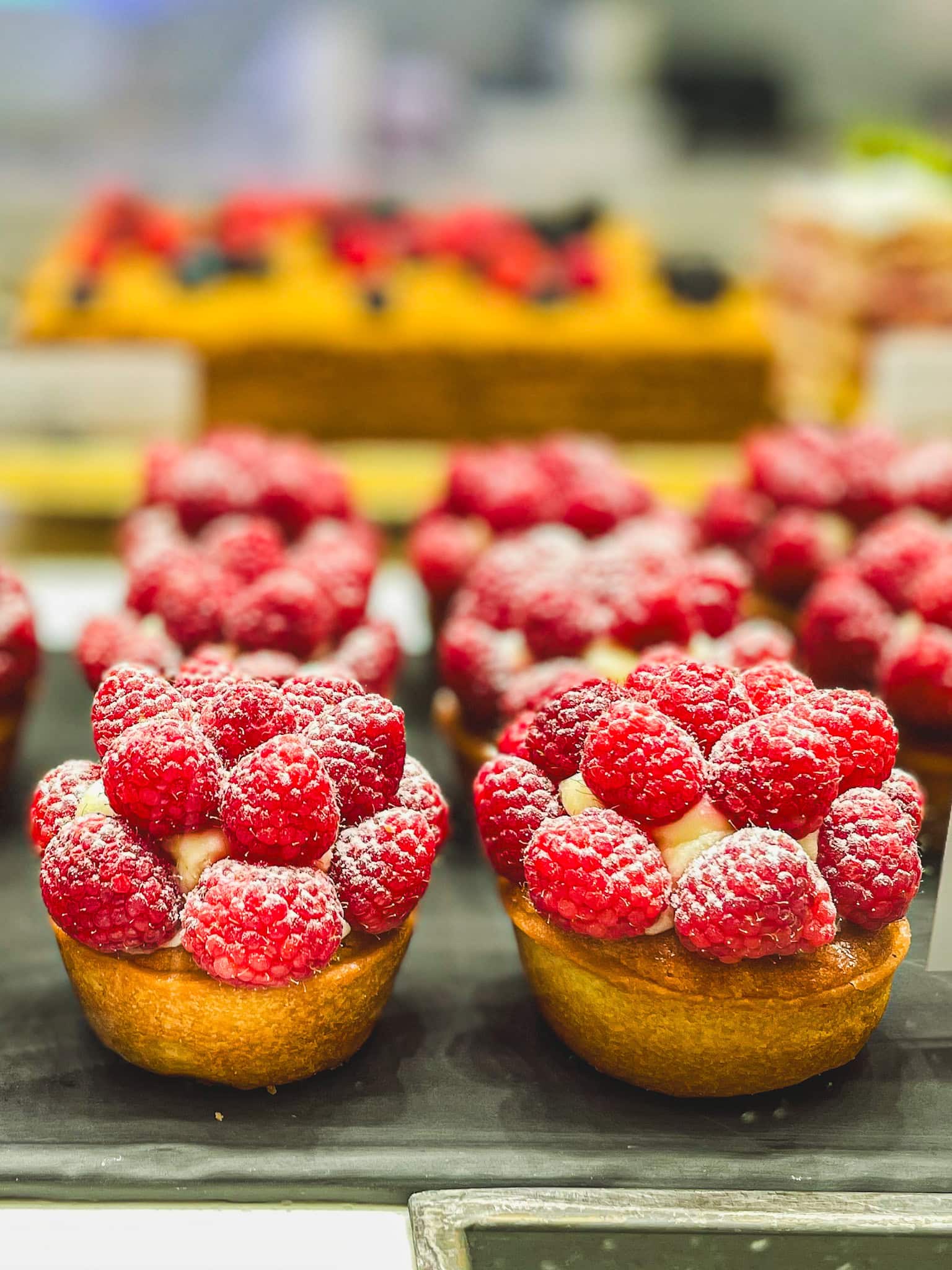 Beautiful tarts topped with raspberries from L'eto in Dubai Mall