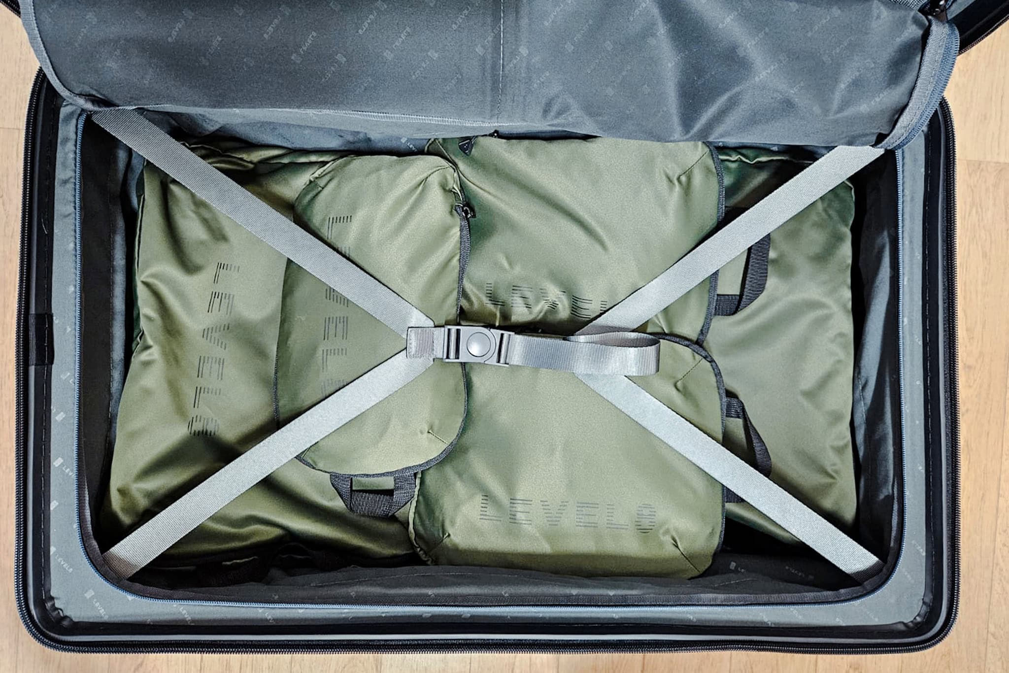level8 voyageur suitcase review: ain compartment of the 26 inch model showing packing cubes and click release straps