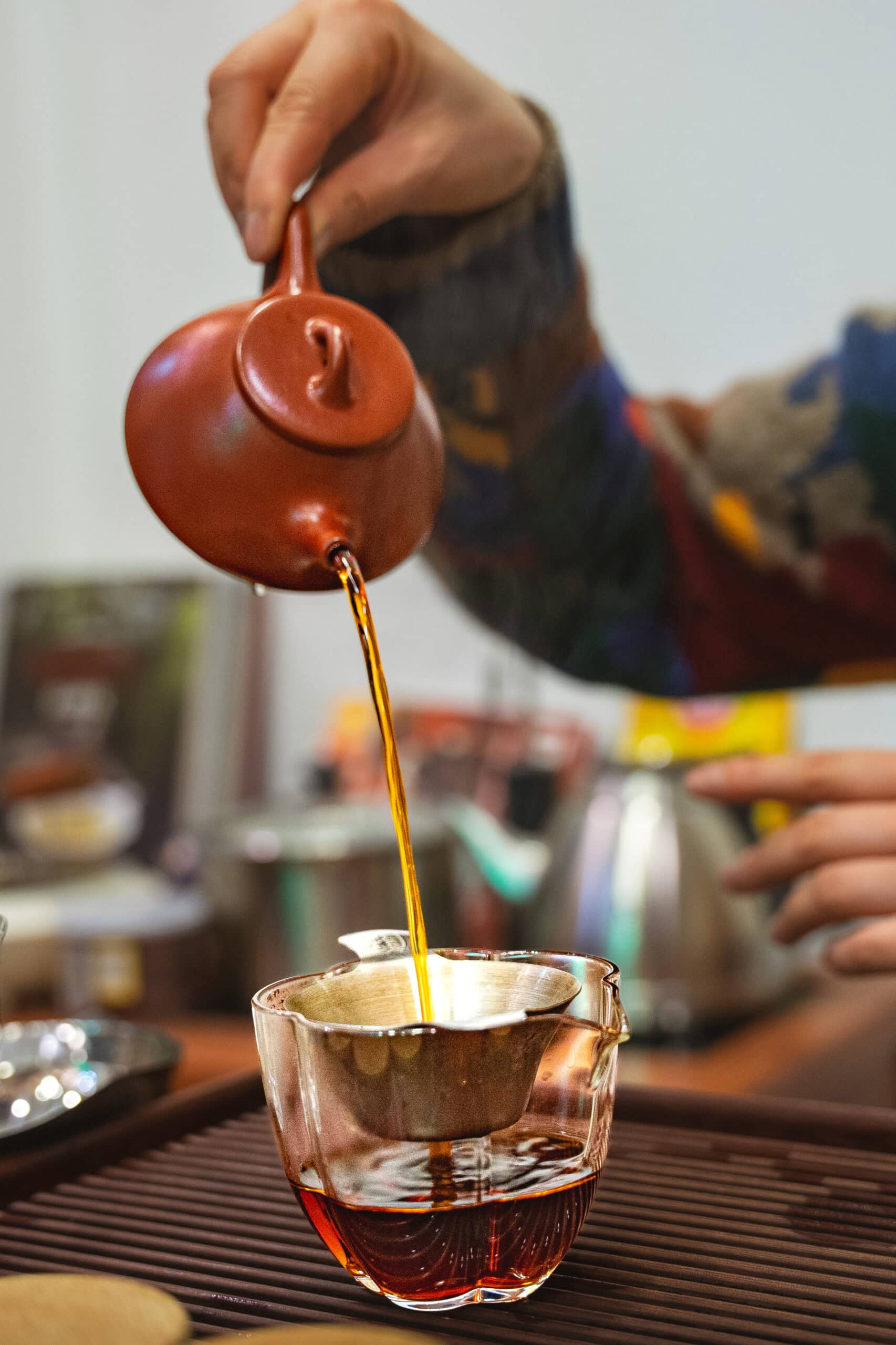 Our hostess pours a cup of fermented pu-erh tea from a Yixing clay pot at Tianshan Tea City in Shanghai