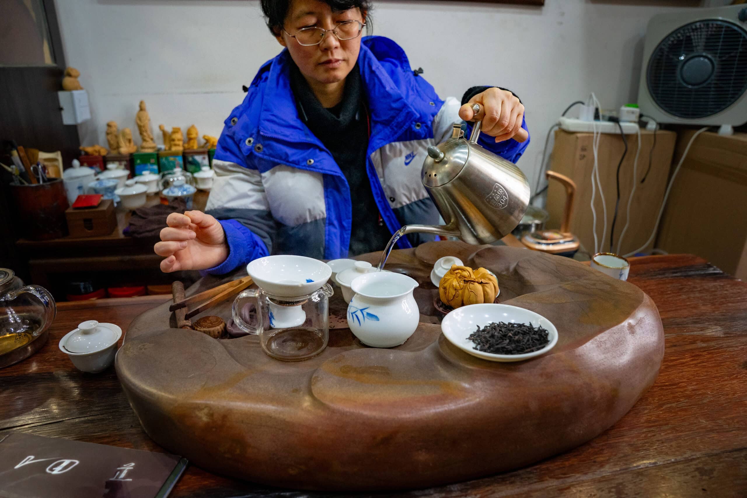 Our hostess pouring hot water over the leaves to wash them