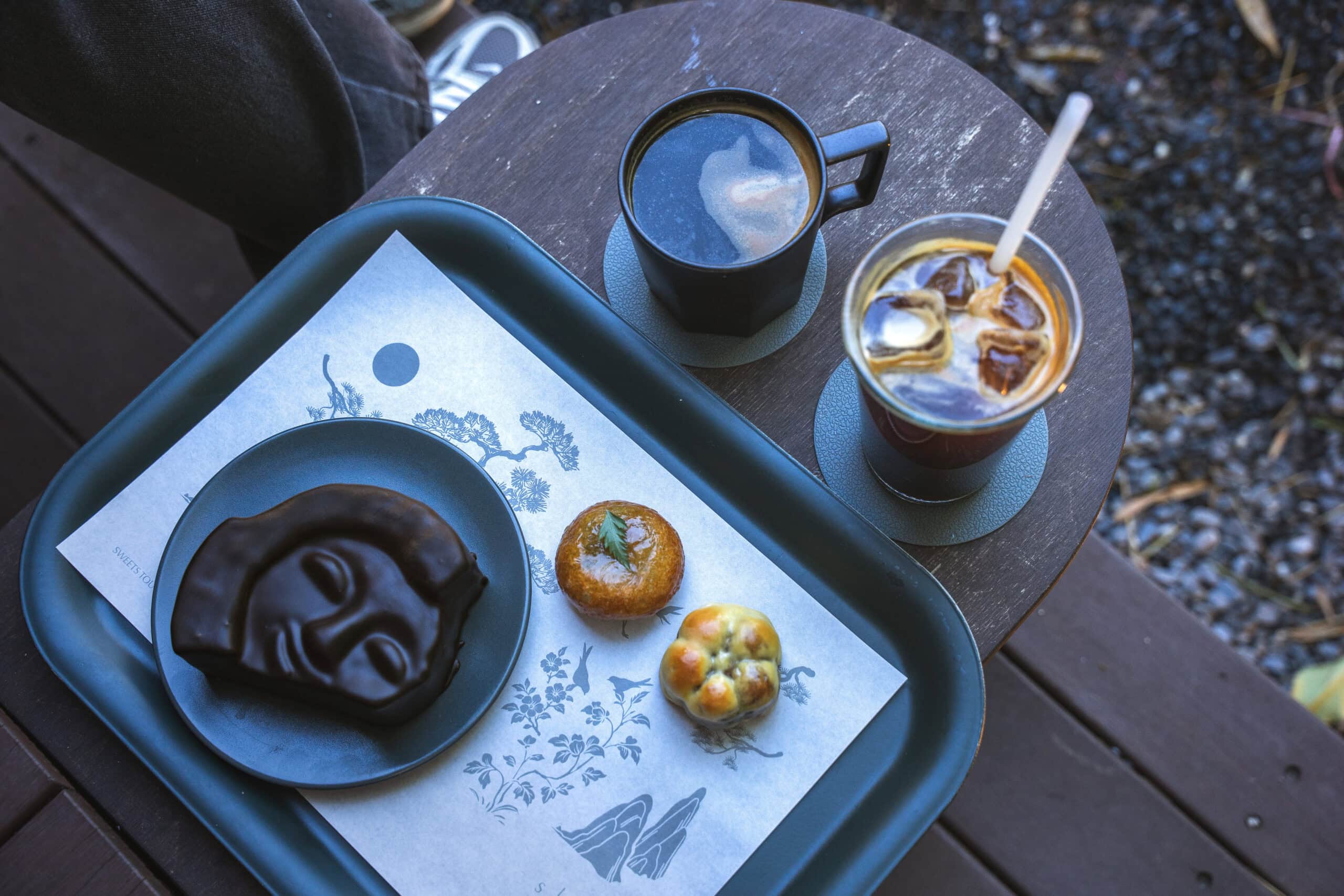 Two coffees, two pieces of Gyeongju  bread and a tiramisu in the shape of Silla Smile that we had at Silladang