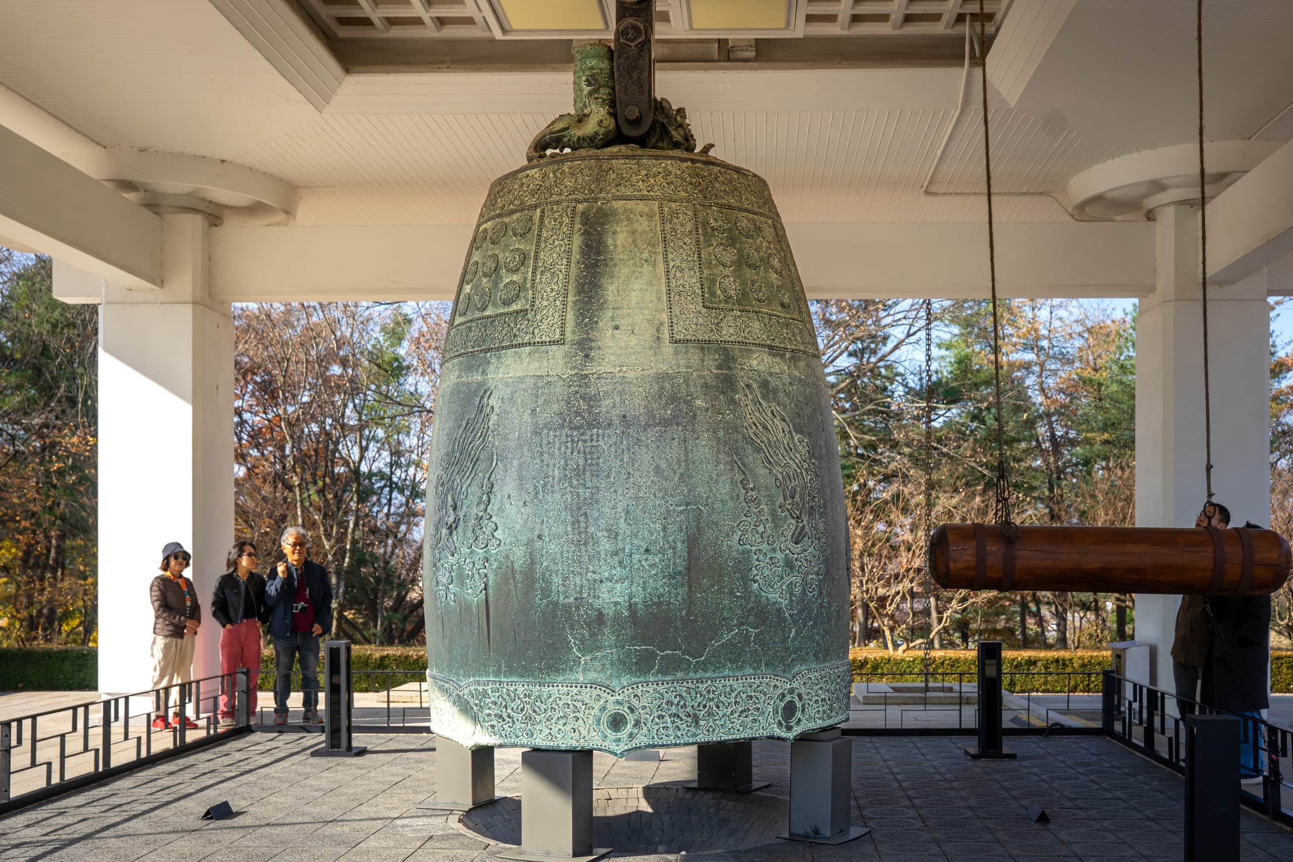 Visitors standing near the Emille Bell at Gyeongju National Museum
