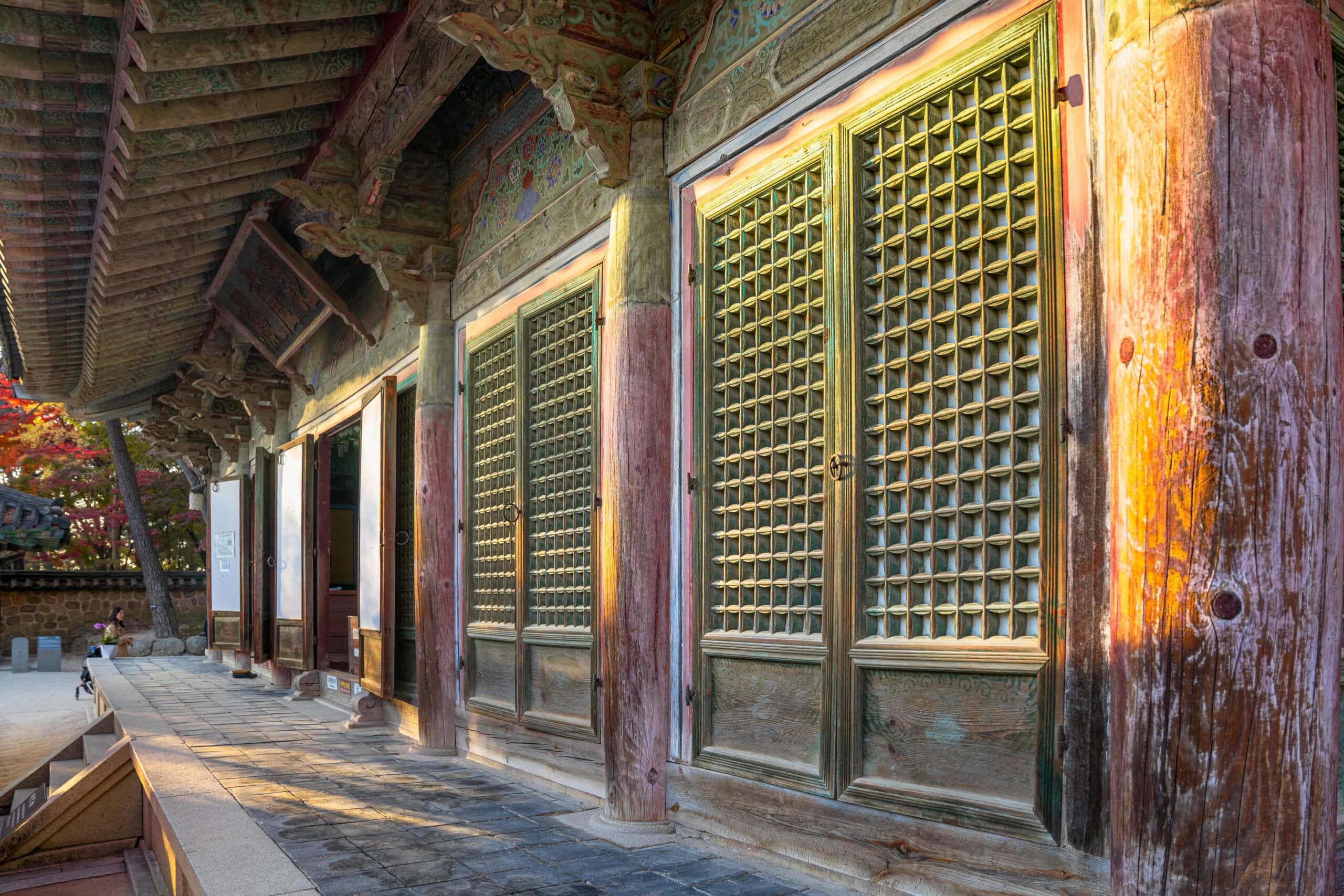Korean temple architecture showing pale green wooden doors
