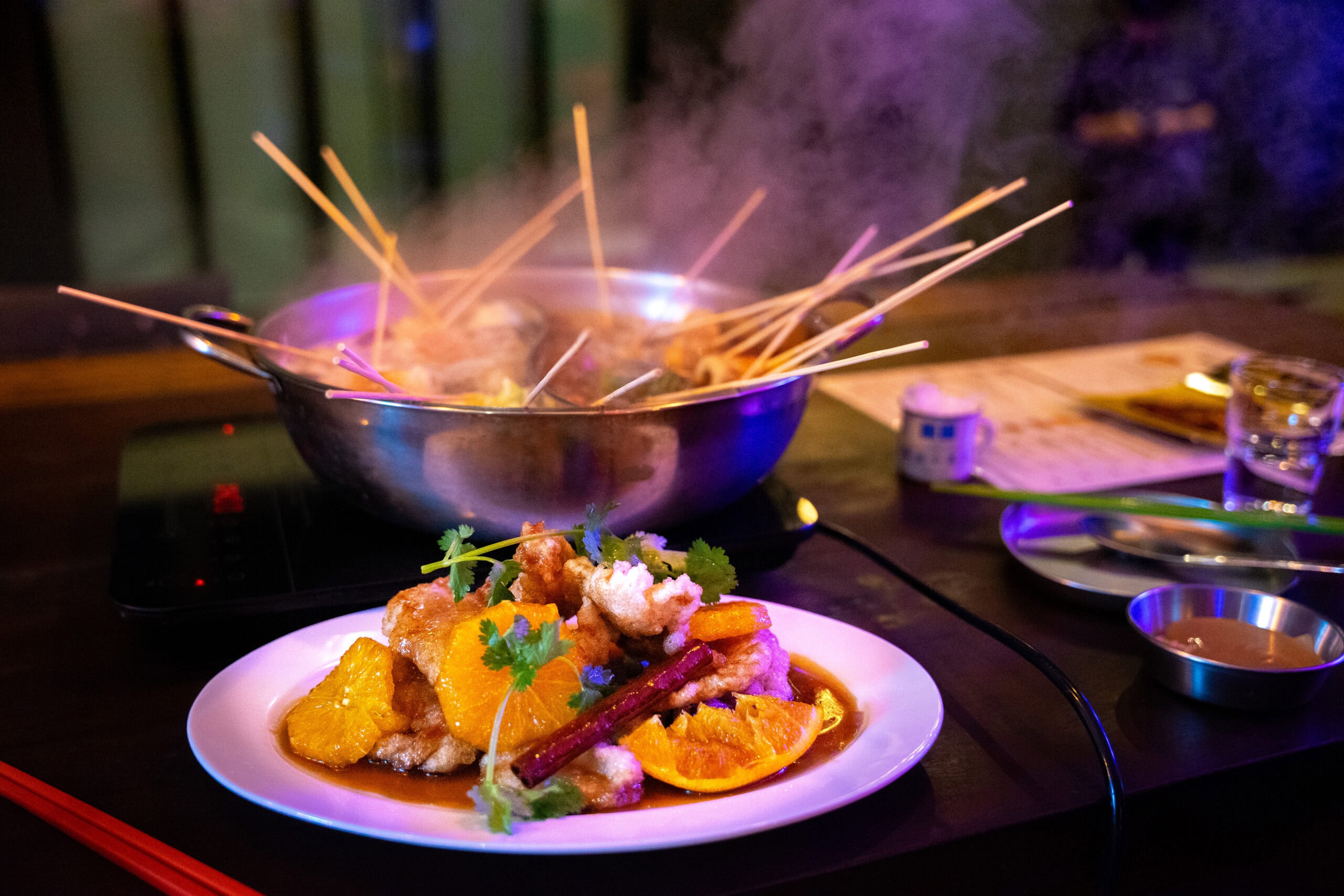 Steaming Sichuan skewers and orange guo bao rou at Chuan Chuan Jiu Ba in the trendy Hip-jiro area of Euljiro.