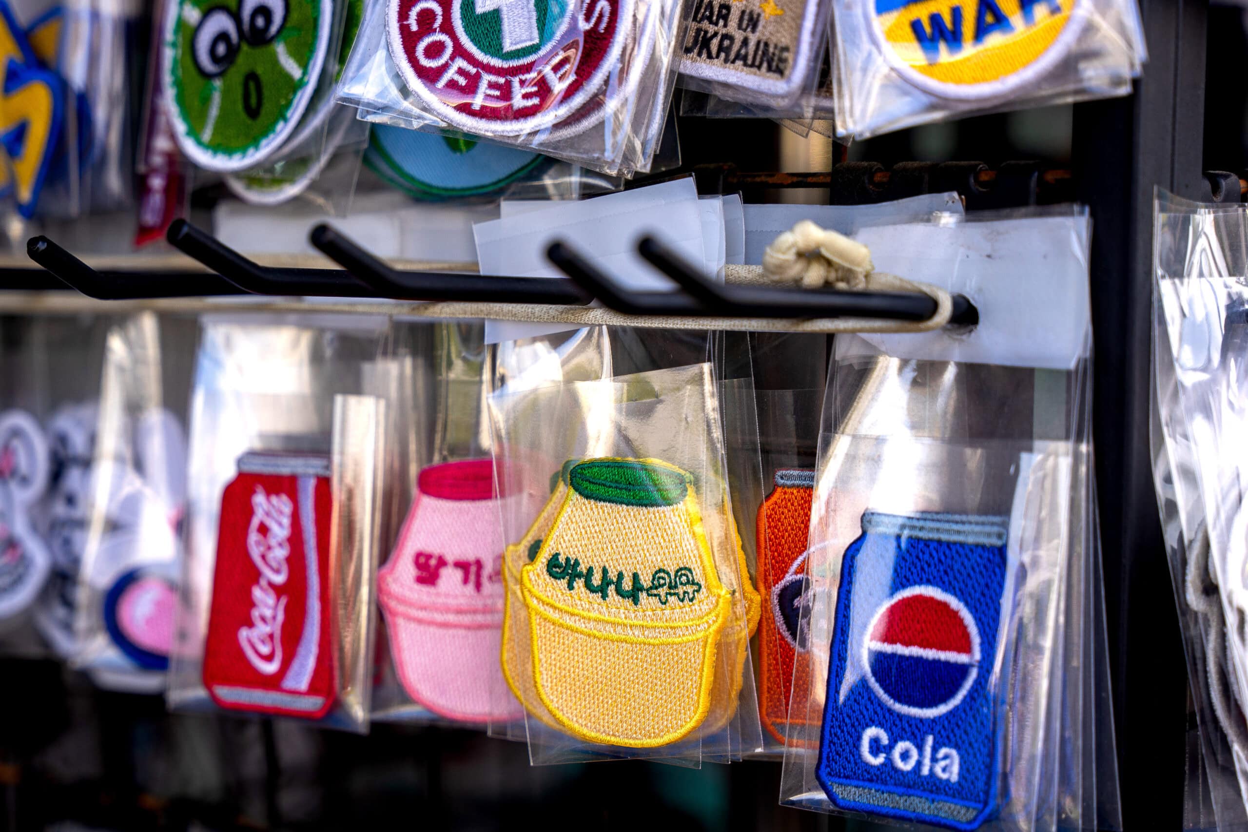 Cute patches of Korean banana milk, cola, and fanta for sale in Dongdaemun market