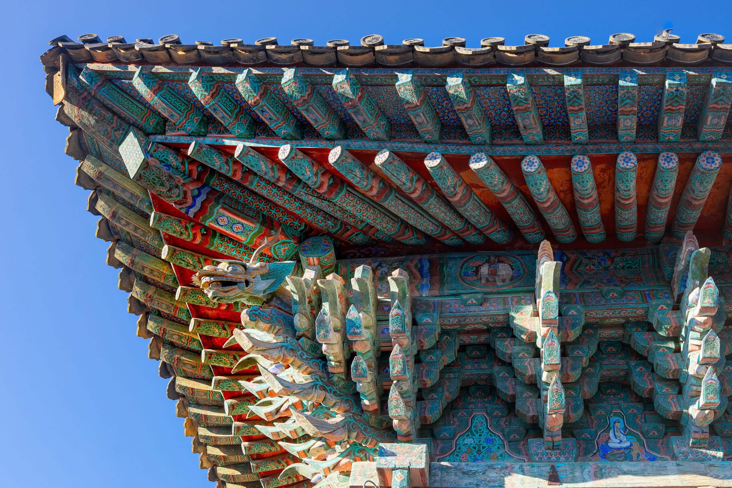Dragon carving tucked between wooden beams at Bulguksa Temple
