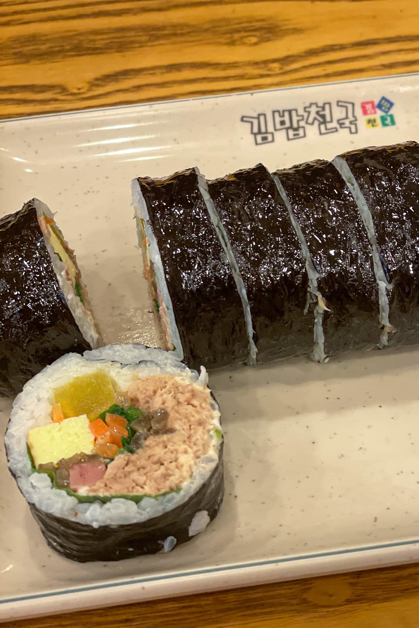A close up of a tuna kimbap from Kimbap Cheonguk