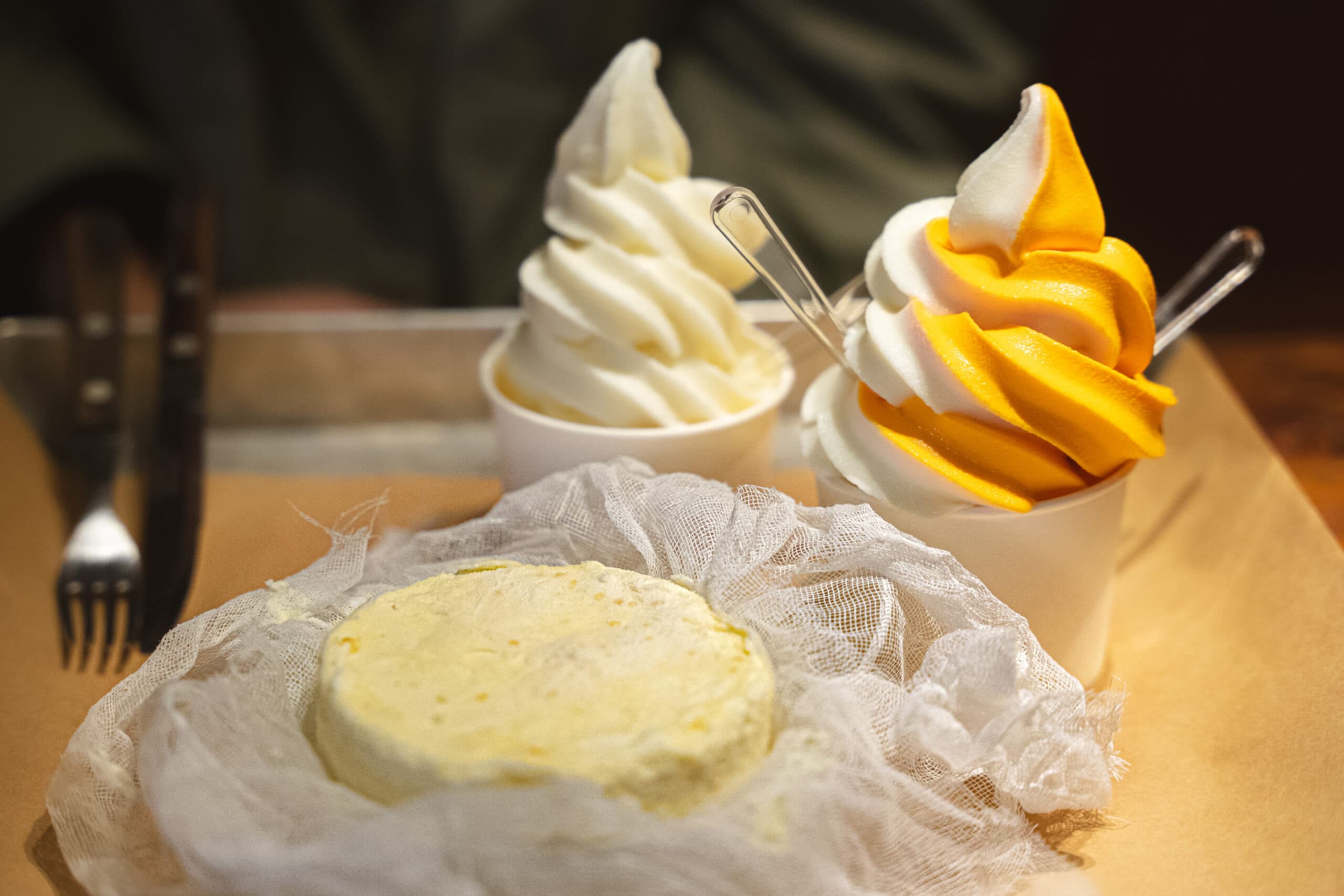 A brie cheese cake wrapped in cheese cloth and two cheese flavoured soft serve ice creams from Cheese Industry (one of the best and most unique cafes in Seoul)