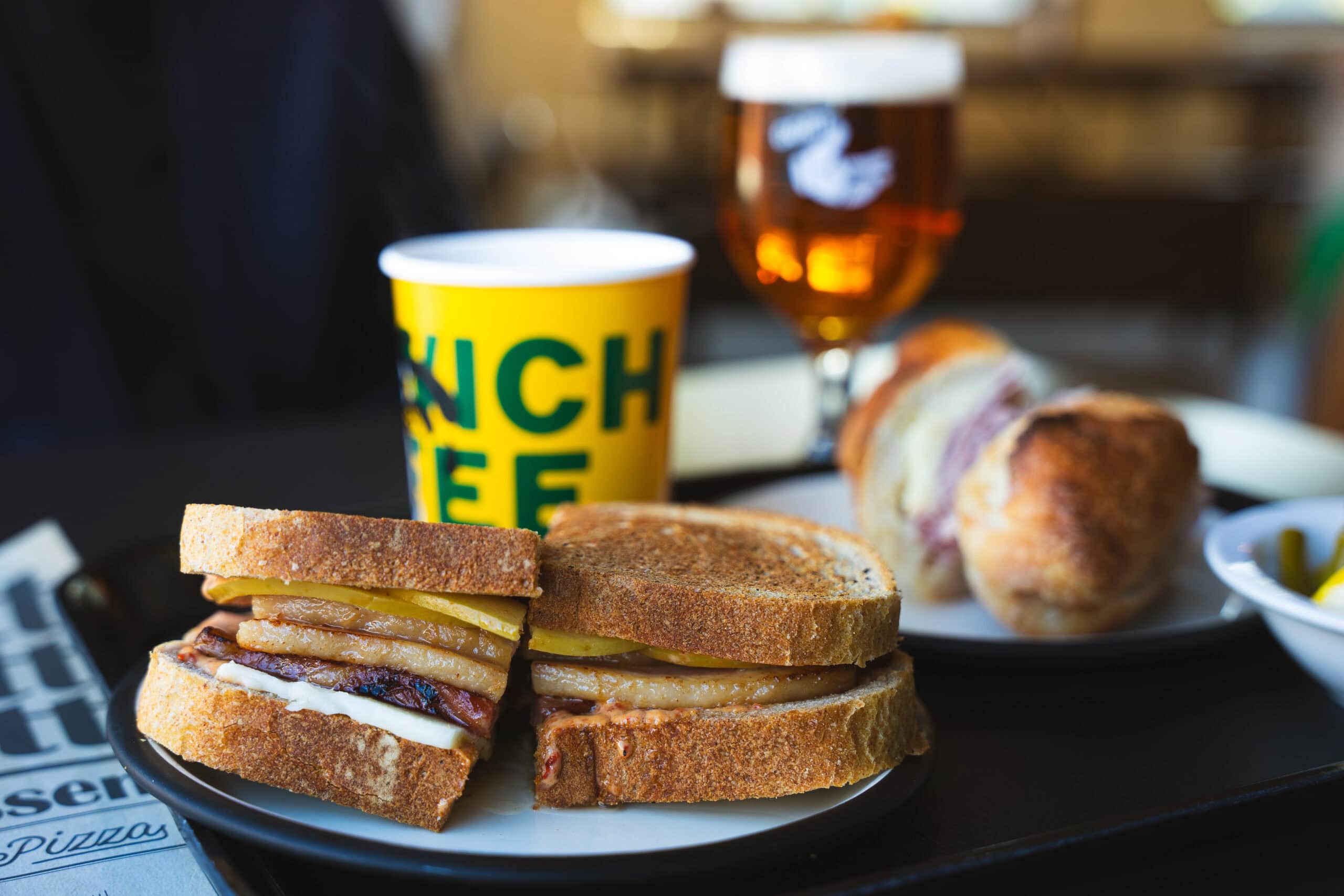 A signature apple bacon sandwich and jambon-beurre baguette at Goat Delicatessen, a repurposed industrial cafe in Mullae-dong.