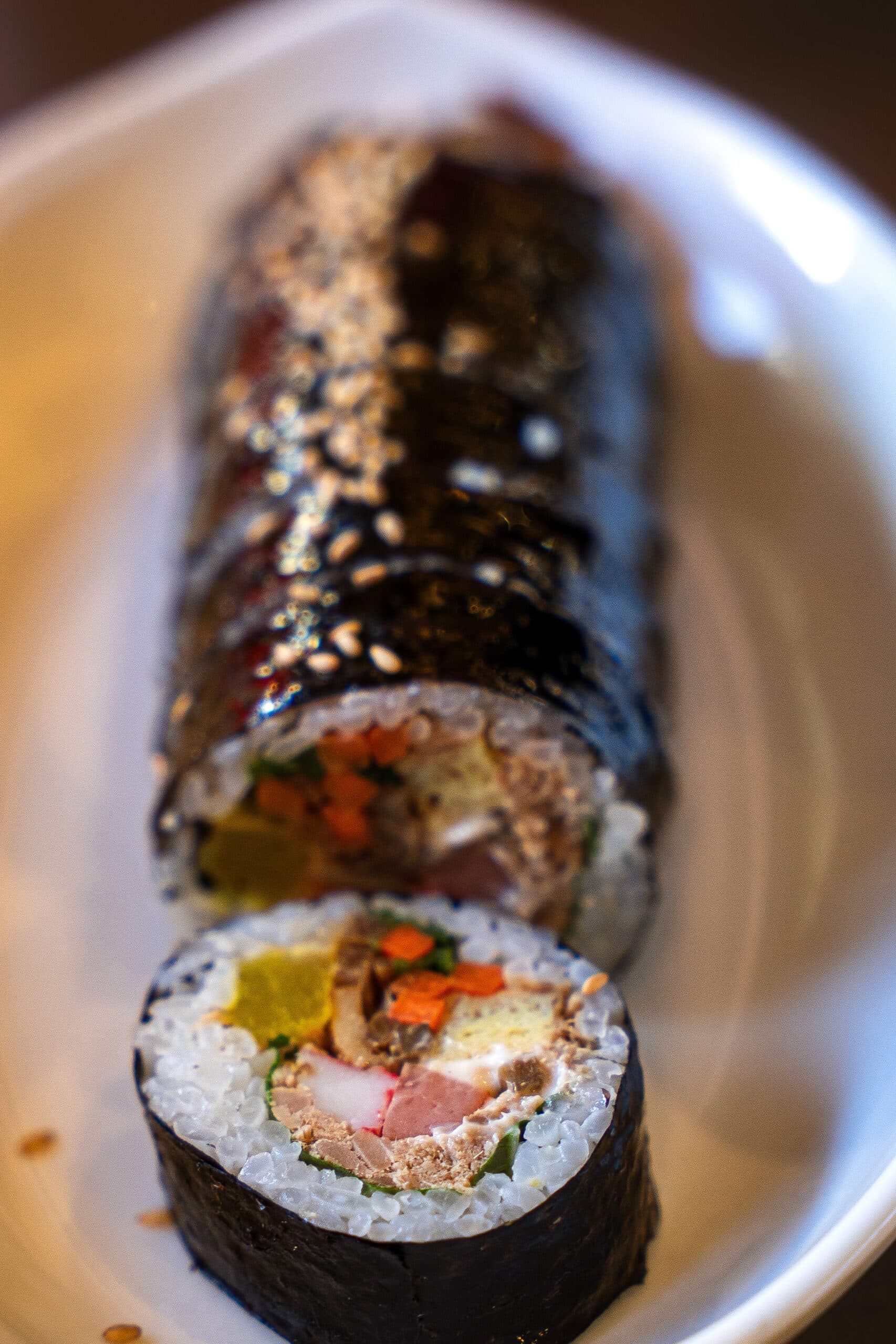 A close-up of a sliced tuna kimbap roll, a classic example of what to eat in Seoul for a quick and delicious lunch