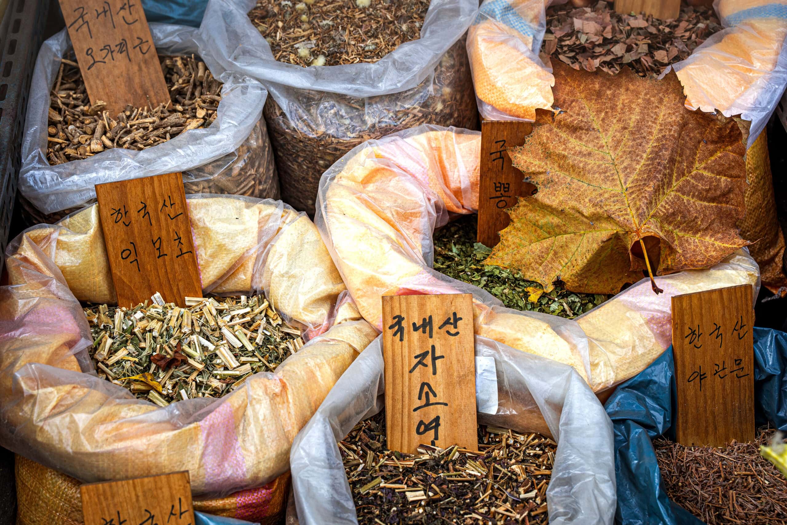 plastic bags of twigs and bark at a medicinal market in Seoul, Korea