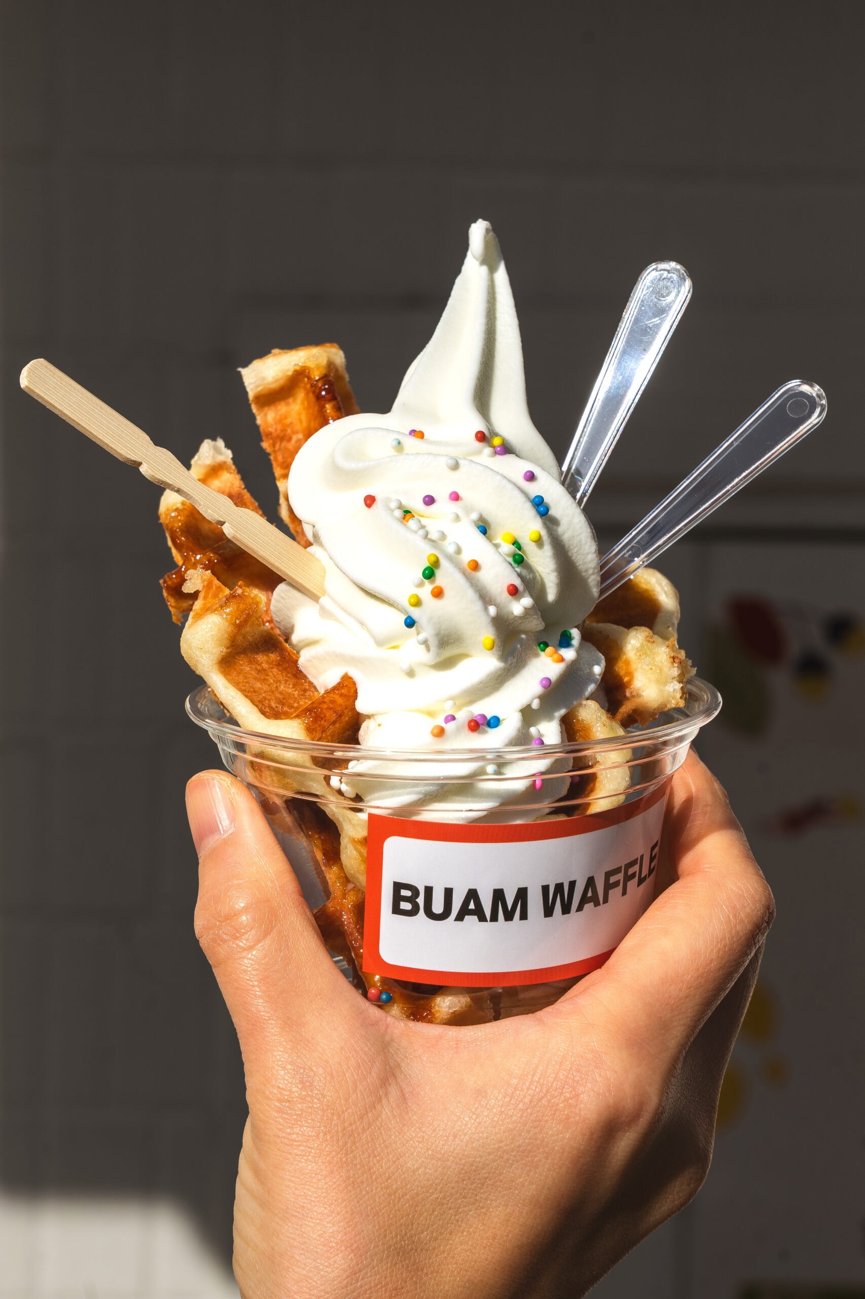 Soft serve ice cream and waffle strips in a plastic cup that we had at Buam Waffle