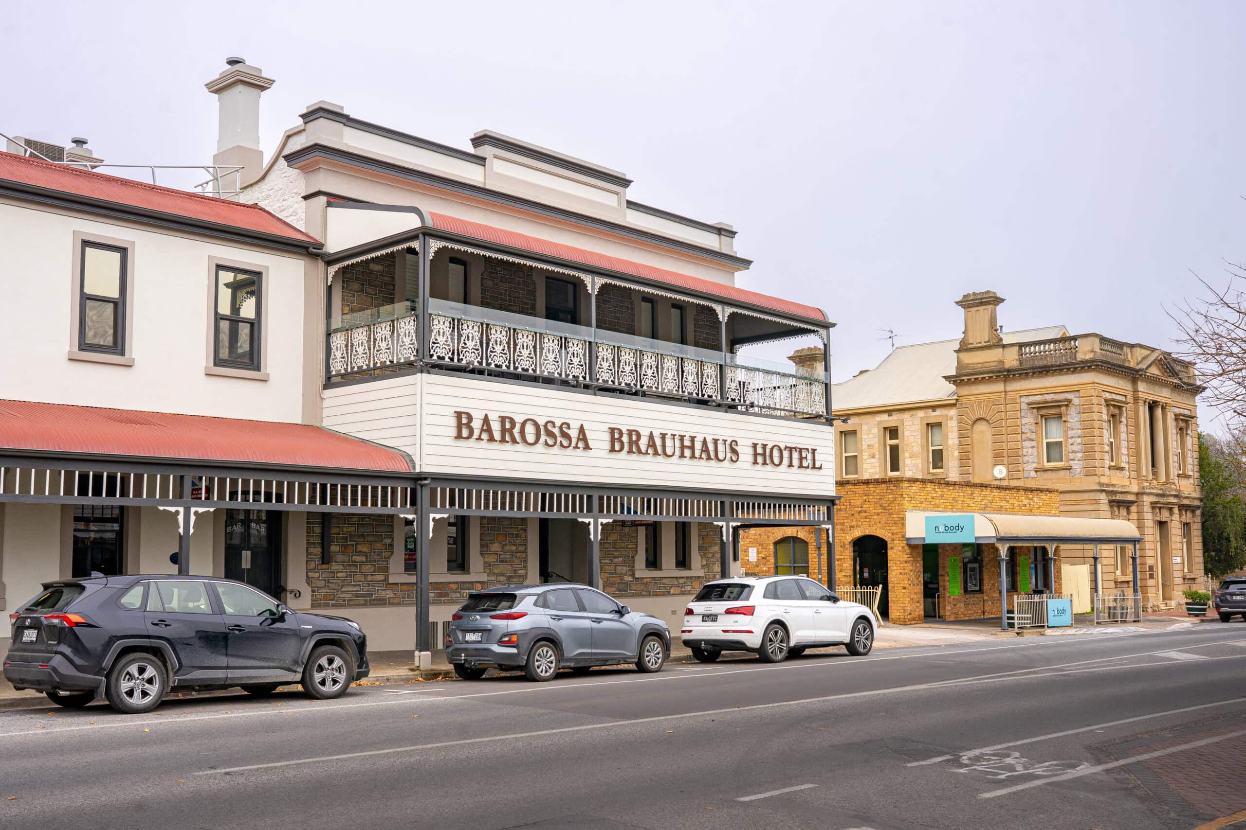 Three cars are parked outisde the Barossa Brauhaus Hotel in Angaston