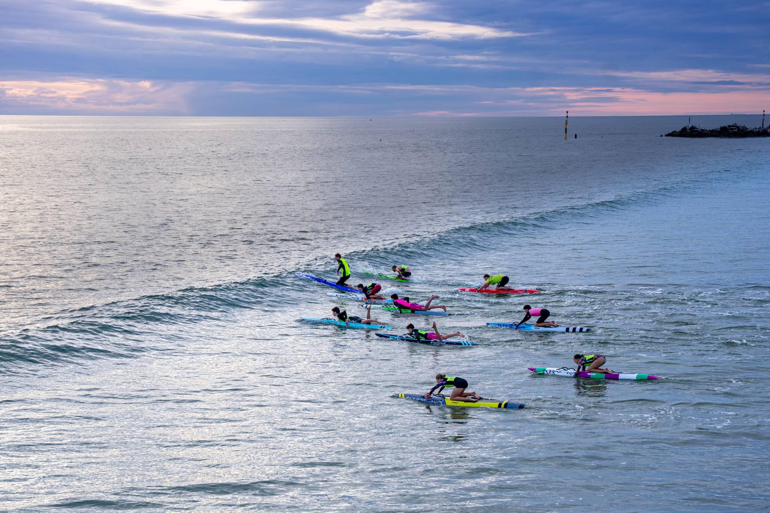 School children paddling surfboards, Glenelg beach
