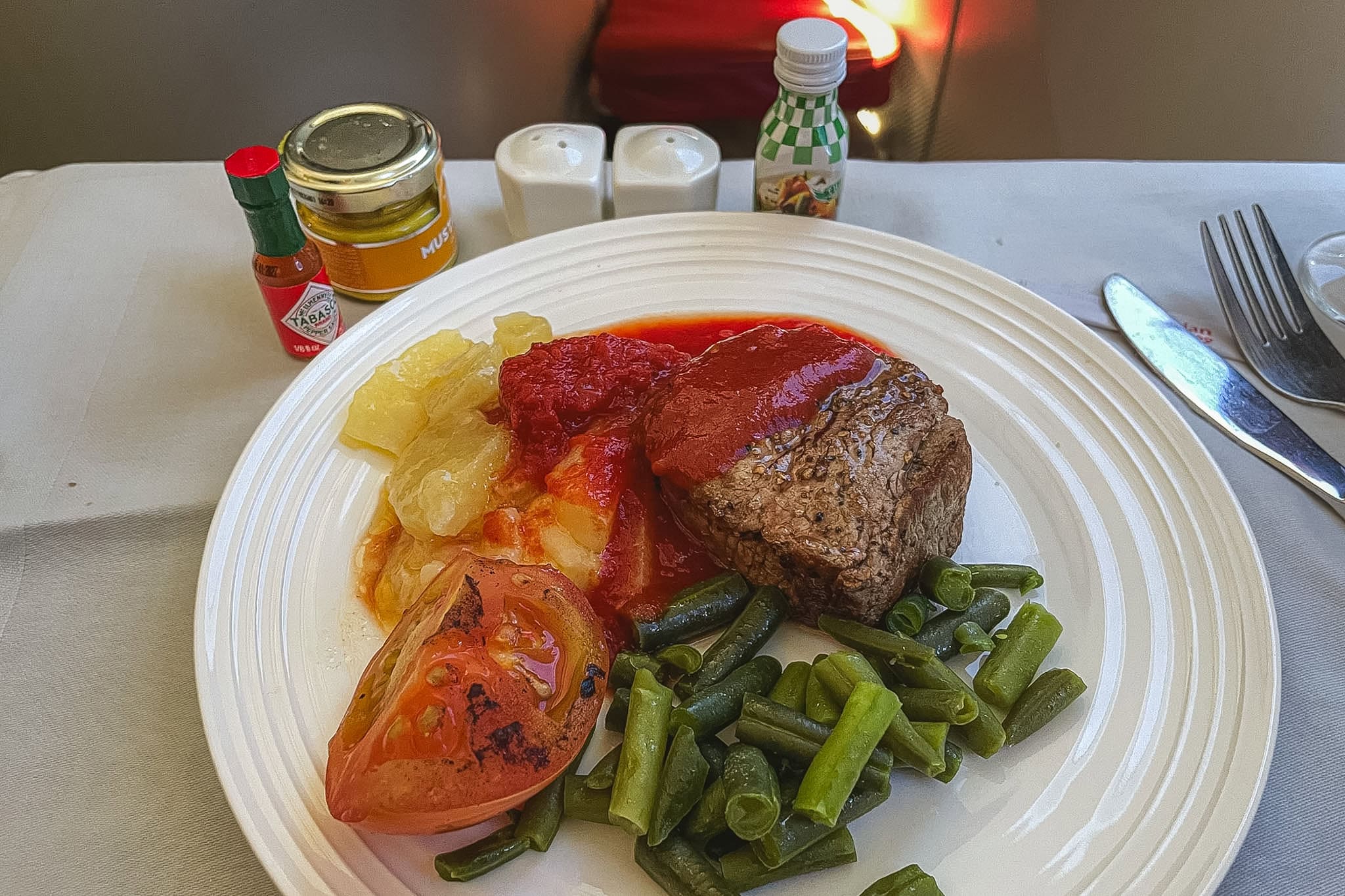 Ethiopian Airlines Business Class food: Steak with green beans, potato, and fried tomato I had on my flight from Johannesburg to Addis Ababa