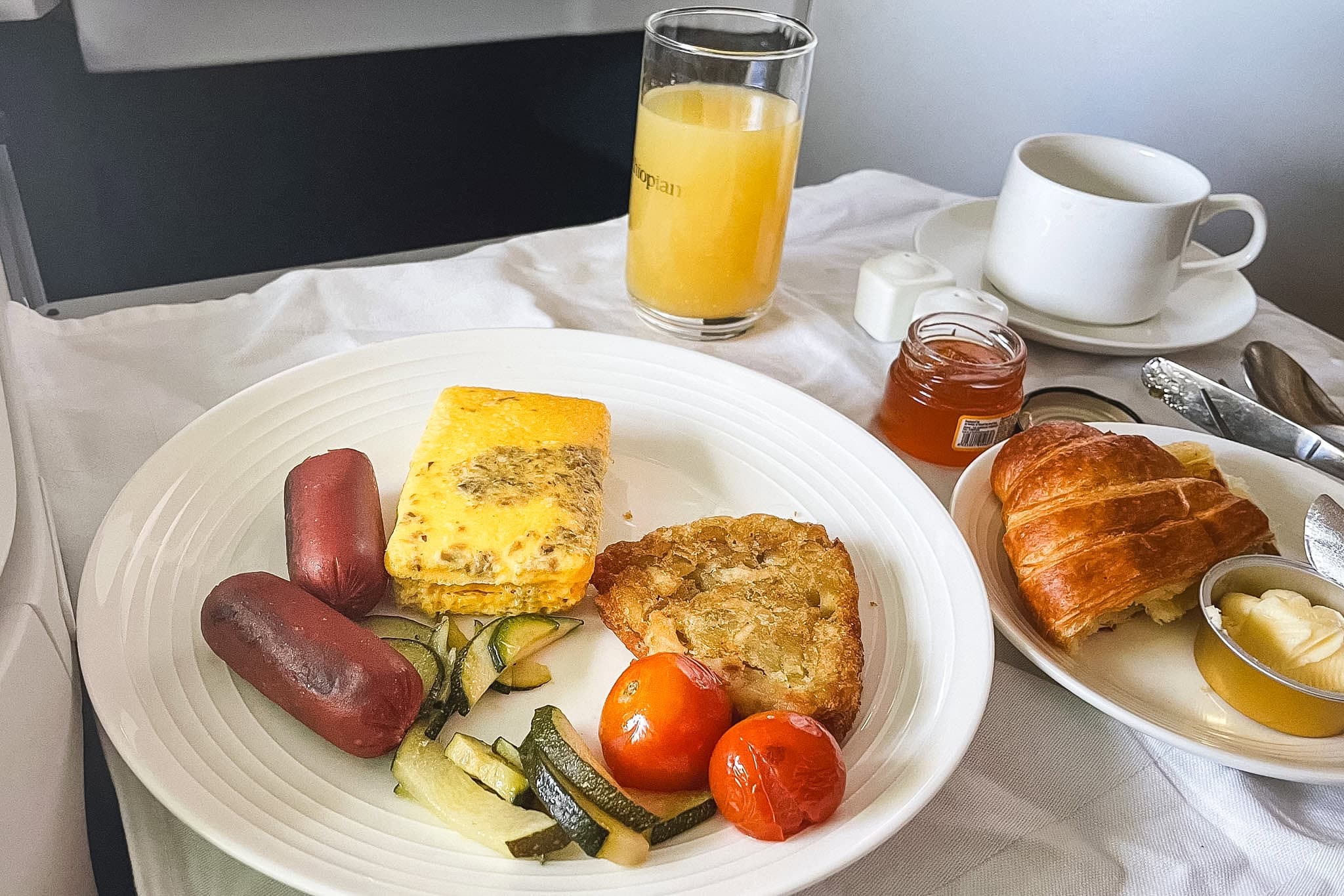 Breakfast of eggs, hash brown, sausage and tomatoes I had for breakfast when I flew Ethiopian Business class from Addis Ababa to Seoul