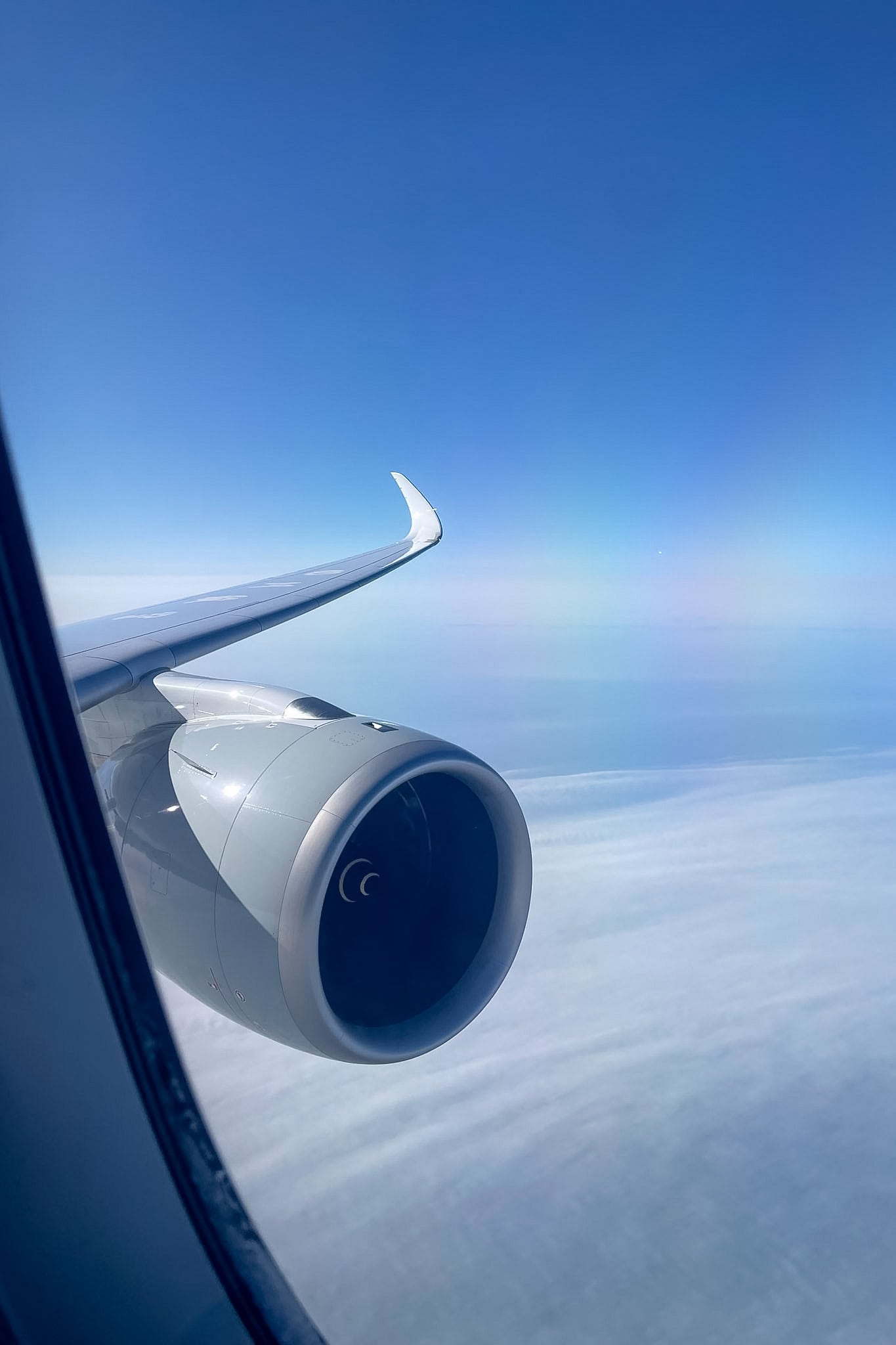 The view from the window towards the wing and engine from Business class