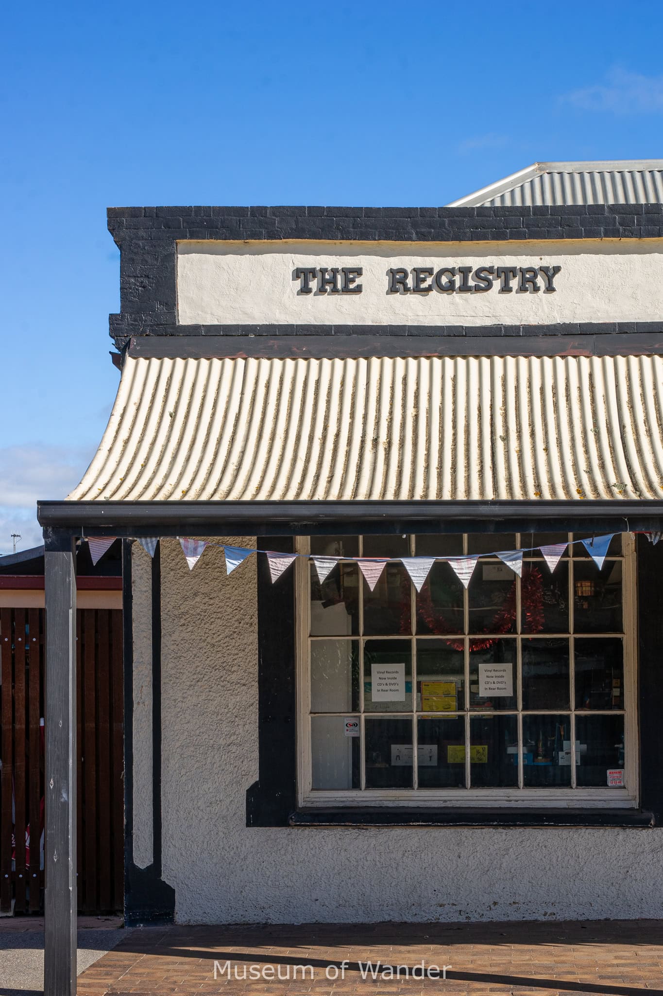 A renovated old building on The Strand in Port Elliot. The white and black building bears the name : The Registry