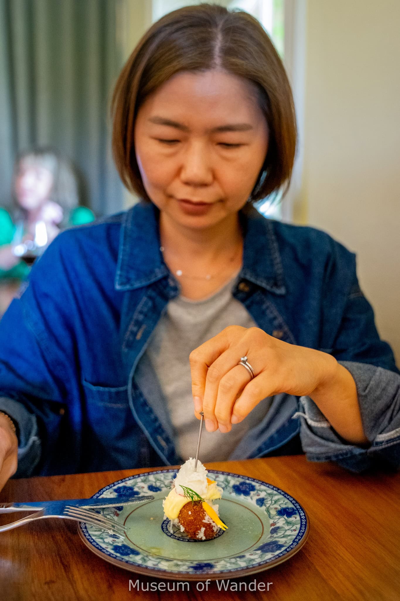 Jin eats a beatiful pork croquette, part of the feed me menu at Salopian Inn