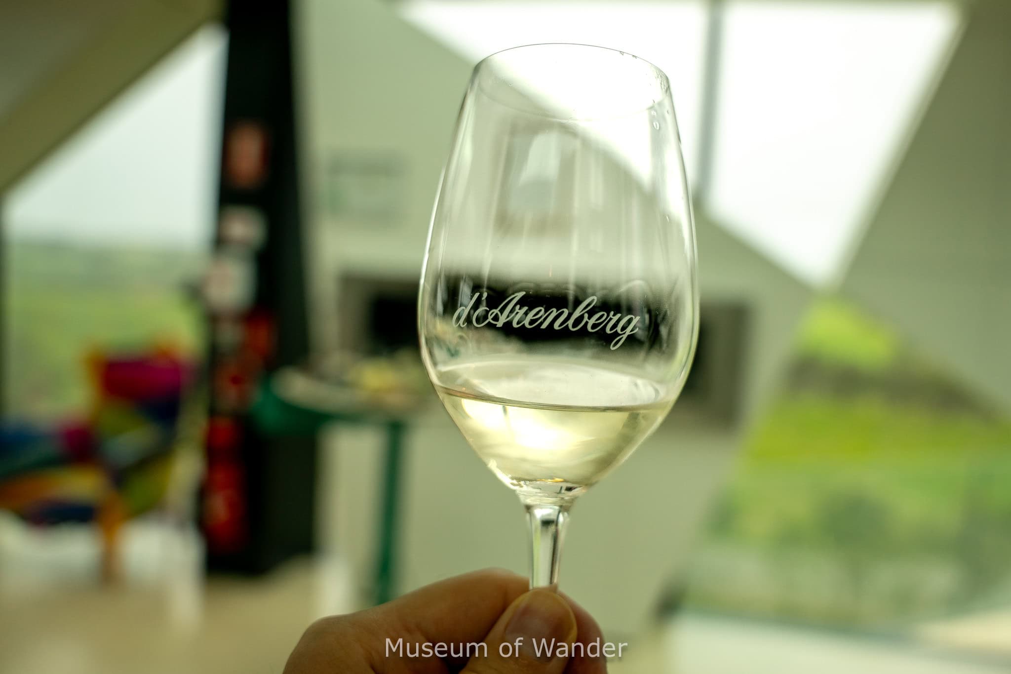 A d'Arenberg branded wine glass with white wine during our wine tasting in McLaren vale
